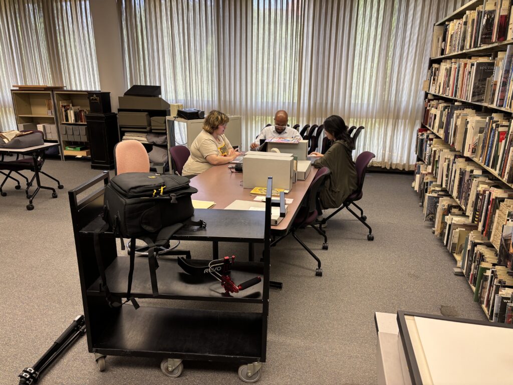 Project team members examine materials